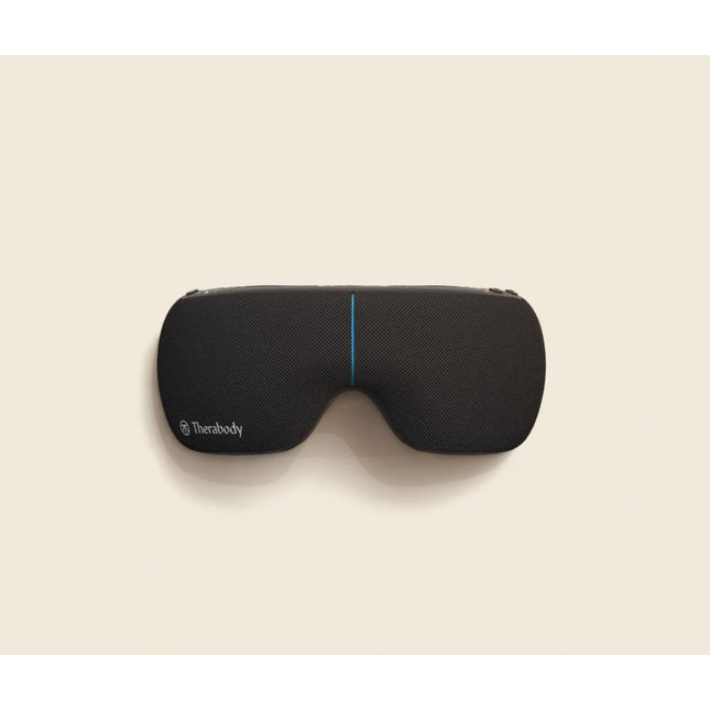 Black sleep mask with Therabody branding on a beige background